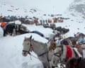 Villagers with oxen and horses ascend Mount Everest during rescue efforts to reach hundreds of hikers trapped by heavy snow