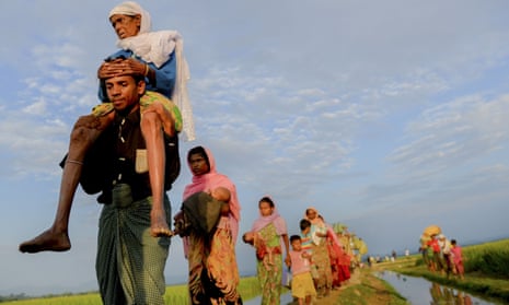Rohingya refugees walk to take shelter in the southern part of Bangladesh at Palongkhali in Coxs Bazar.