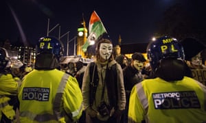 Anti-capitalist protesters wearing Guy Fawkes masks take part in the "Million Masks March" in Parliament Square in London on November 5, 2014