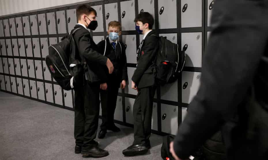 Pupils interact next to lockers at The Fulham Boys School on the first day after the Christmas holidays