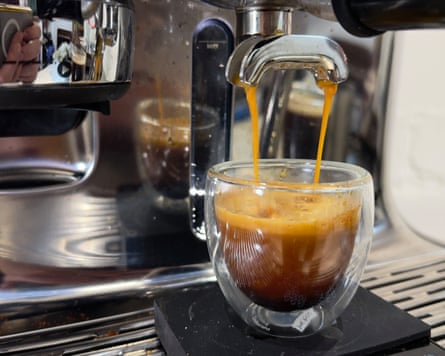 Coffee fills an espresso cup on the Oracle Jet