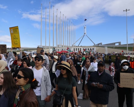 Protesters arrive at Parliament House in Canberra on Sunday.