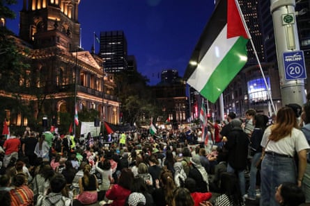 People attend the vigil outside Sydney’s Town Hall.