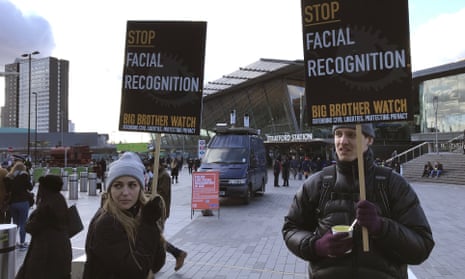 People protest facial recognition technology in London on 11 February. Amnesty International is urging New York City to ban the technology.