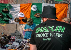 A man looks at the merchandise on a market stall at Croke Park, Dublin.