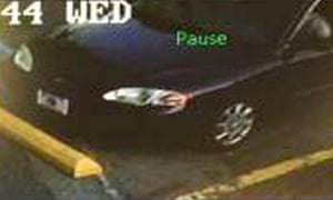 The suspect was seen leaving the church in the pictured black four door sedan.