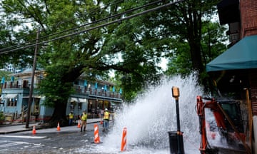 Water gushes out of a broken water transmission line in downtown Atlanta, Saturday, June 1, 2024. Much of Atlanta, including all of downtown, has been without water since Friday afternoon after crews began work to repair breaks on transmission lines in the downtown area. (AP Photo/Mike Stewart)