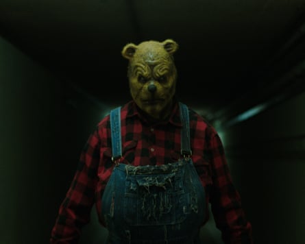 A nightmarish image of Winnie-the-Pooh in a ripped outfit.