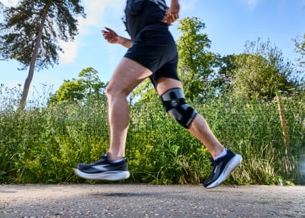 Ioan’s legs and feet in mid-air as he jogs along the path