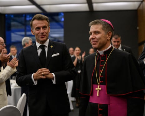 France's president and Andorra’s co-prince Emmanuel Macron arrives as he is welcomed by the second co-prince Josep-Lluis Serrano Pentinat (R), ahead of a dinner in Andorra.