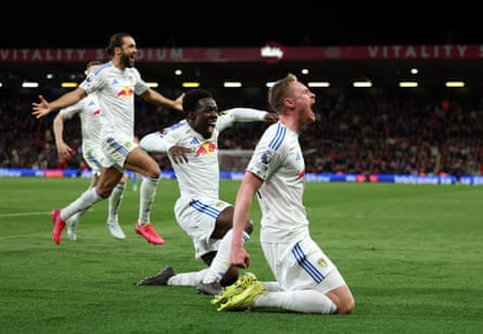 Sean Longstaff celebrates with Wilfried Gnonto.