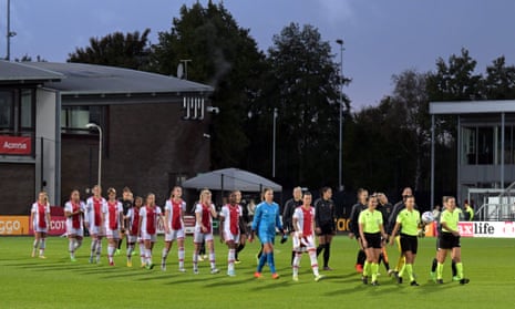 Ajax v Arsenal: Girls’s Champions League qualifying, spherical two, second leg – dwell | Girls's Champions League 2 The match officials lead the players out onto the pitch at sports complex De Toekomst.