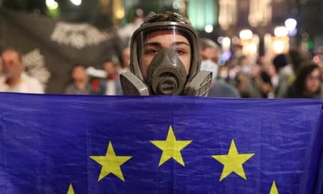 A demonstrator holds a flag of the European Union during a protest in Tbilisi.
