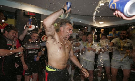 Then Saracens assistant coach, Alex Sanderson, is showered with beer after the 2018 Premiership final