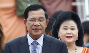 The family of Hun Sen, shown with wife Bun Rany, is accused of bleeding the country of wealth under his prime ministership.