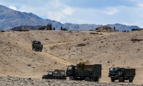 Indian troops drive on exercises near the Himalayan border