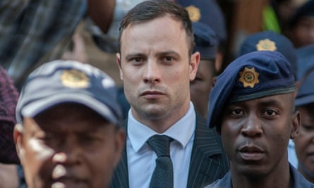 Oscar Pistorius leaves the high court in Pretoria after the second day of his sentencing in his murder trial on 14 October 2014.