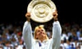 Martina Navratilova holds up the golden winners' plate after winning Wimbledon in July 1990