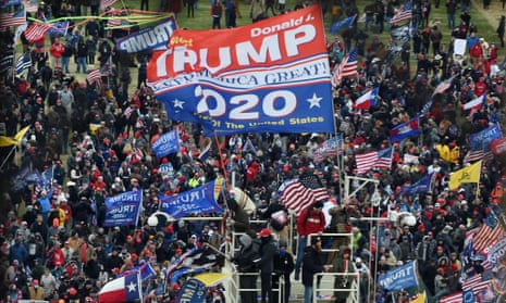 Donald Trump supporters take over stands set up for the presidential inauguration on 6 January.