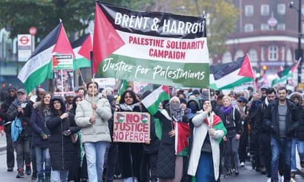 Pro-Palestinian protesters with banners and flags on the street