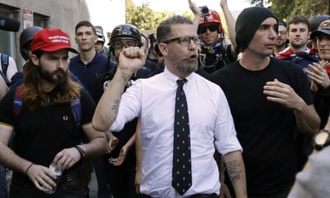 Vice Media co-founder Gavin McInnes, center, founder of the far-right group Proud Boys, is surrounded by supporters after speaking at a rally in Berkeley, California on 27 April 2017.