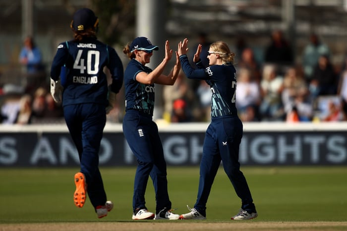 Dean celebrates with team mates after taking the wicket of Bhatia.