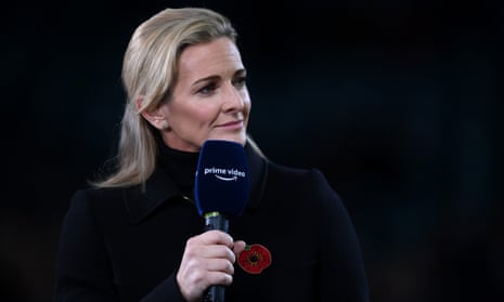 The sports presenter Gabby Logan with a microphone.