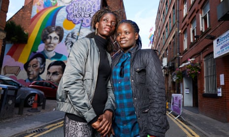 Megan Nankabirwa ( blue hair tips) and her partner Lydia Nabukenya in Manchester’s gay village. 