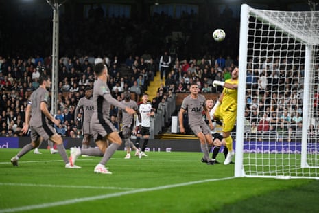Tottenham Hotspur's Fraser Forster attempts to stop the own goal scored by Micky van de Ven.