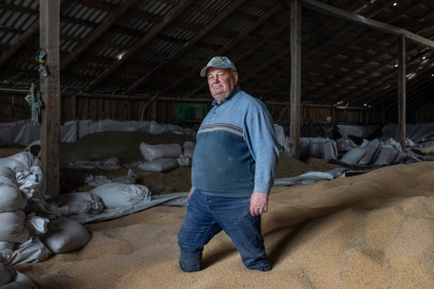 A Ukrainian farmer in his grain storage facility near Kyiv
