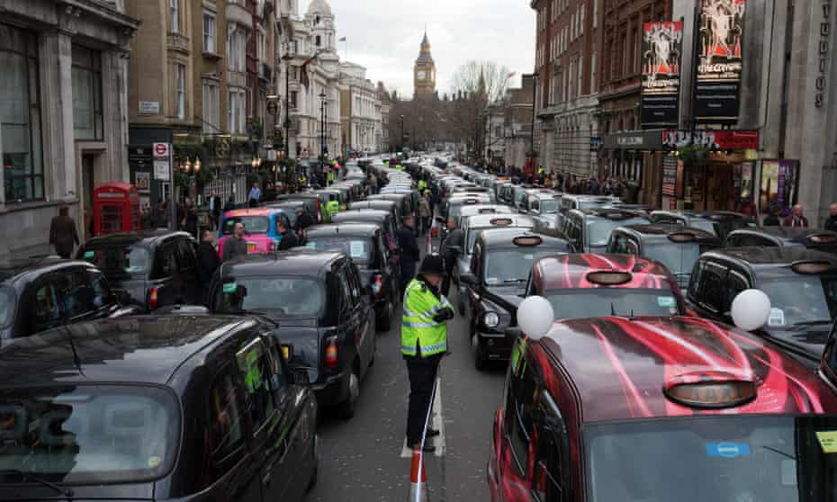 London black cab drivers block Whitehall as they take part in a protest against Uber on 10 February, 2016.