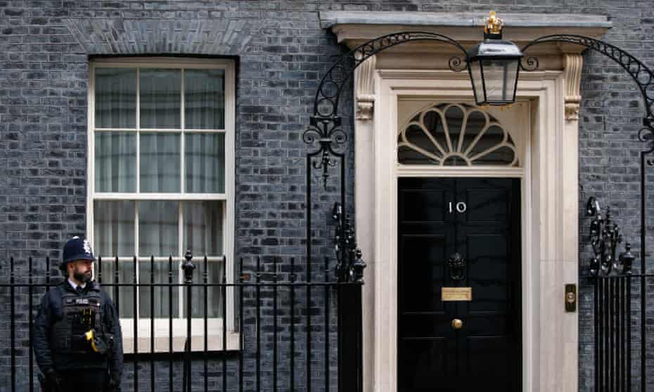 A police officer stands outside the door of 10 Downing on 9 February 2022. 