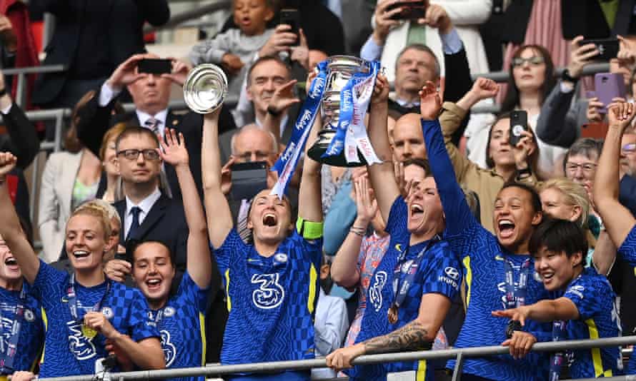 Magdalena Eriksson and Millie Bright lift the Women's FA Cup trophy after Chelsea's victory over Manchester City at Wembley Stadium on May 15, 2022.