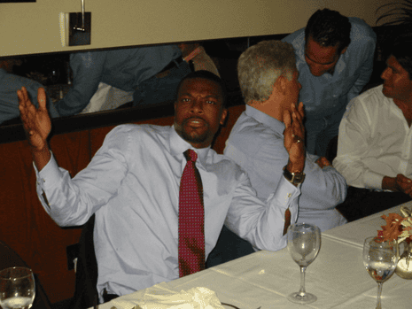 Chris Tucker and Bill Clinton in a partially redacted photo.