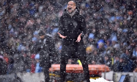 Pep Guardiola in the snow at the Etihad
