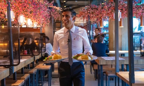 Chancellor Rishi Sunak serving diners at a branch of Wagamama restaurant