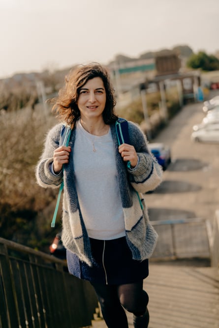 Paula with a rucksack climbing steps