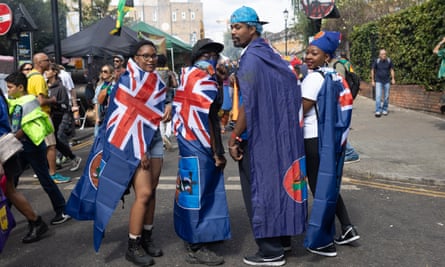 From right: Nadika Brown, her husband, Darius, and nephew Declan Watts and his girlfriend, Rianna Youngsan, all displaying Monserrat flags.