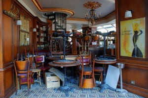 Chairs and tables are seen piled up in a closed restaurant in Paris amid in France, on 27 April, 2021.