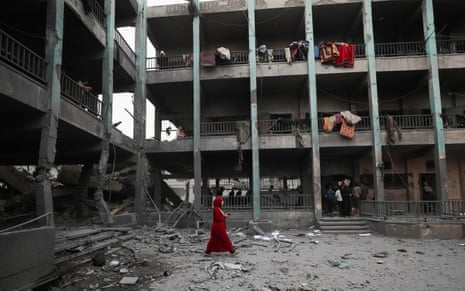 Palestinians inspect the damage at a school sheltering displaced people, following an Israeli strike, in Jabalia refugee camp, in the northern Gaza Strip.