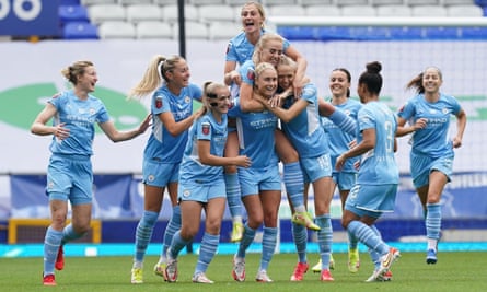 Manchester City players mob Steph Houghton after her superb second-half free kick at Goodison Park.