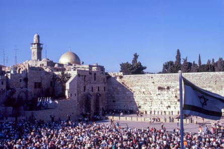 overhead view of wall with crowd of people next to it