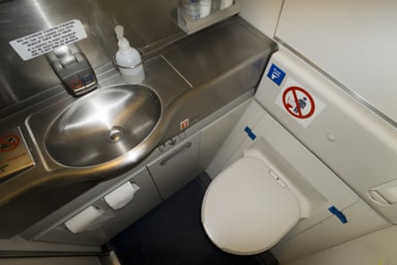 An aerial view of a compact lavatory aboard a Boeing 777 aeroplane