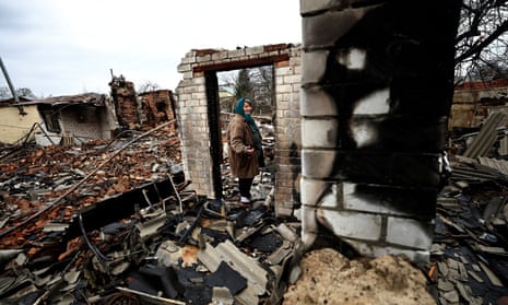 Natalia Titova, 62, shows the remains of her house, which was destroyed by Russian shelling in Chernihiv.