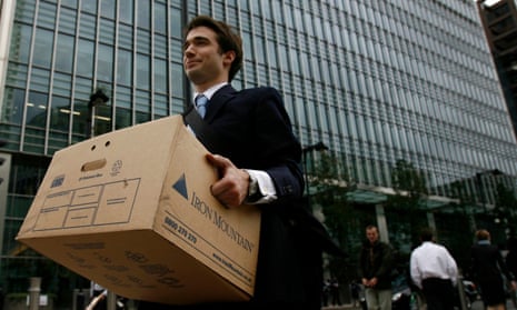 A worker leaves Lehman Brothers’ offices in Canary Wharf in September 2008.