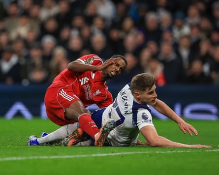 Alexander Isak is injured in a tackle with Micky van de Ven after scoring against Spurs