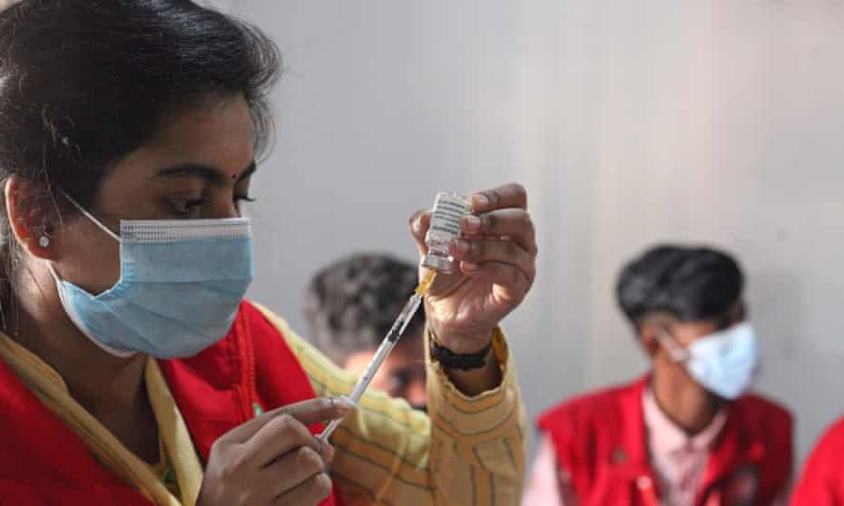 A nurse draws up a shot of Covid-19 as part of a drive in Bangladesh to vaccinate slum dwellers in Dhaka.