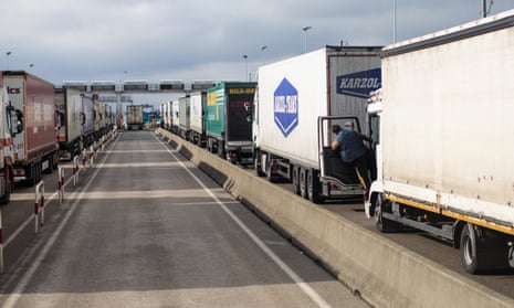 Lorries wait to board a freight train in Calais.