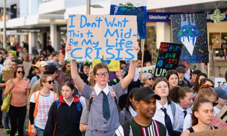 Students hold placards during a strike to raise climate change awareness in Christchurch, New Zealand. 