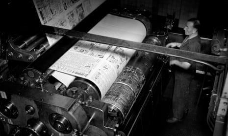 A printer watches over a newspaper press in 1935.
